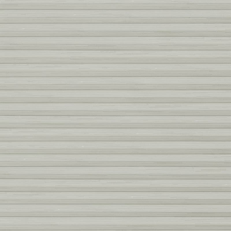 Horizontal pleated cellular blind, fully closed and evenly lowered, diffusing soft light; set against a neutral-colored interior wall, creating uniform horizontal striping across the window area.