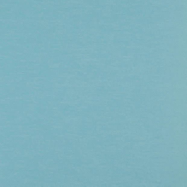 Light blue textured fabric or painted wall filling the frame; lying flat and evenly lit; diffuse daylight ambience with no visible objects, depth cues, or distinct features.