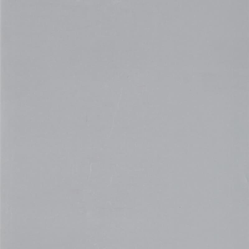 Light gray textured sheet with faint creases occupying the entire frame, lying flat under soft, even lighting with no visible surroundings.