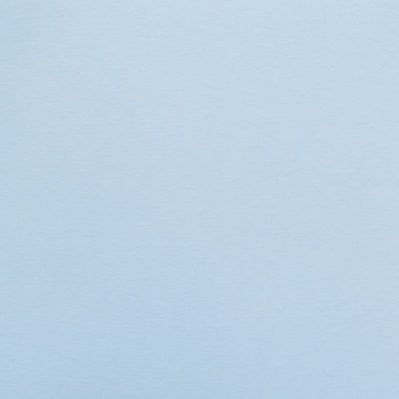 Light blue fabric-like wall covering occupying the entire frame, evenly lit and smooth with subtle horizontal texture; minimal interior context with no visible fixtures, windows, or objects.