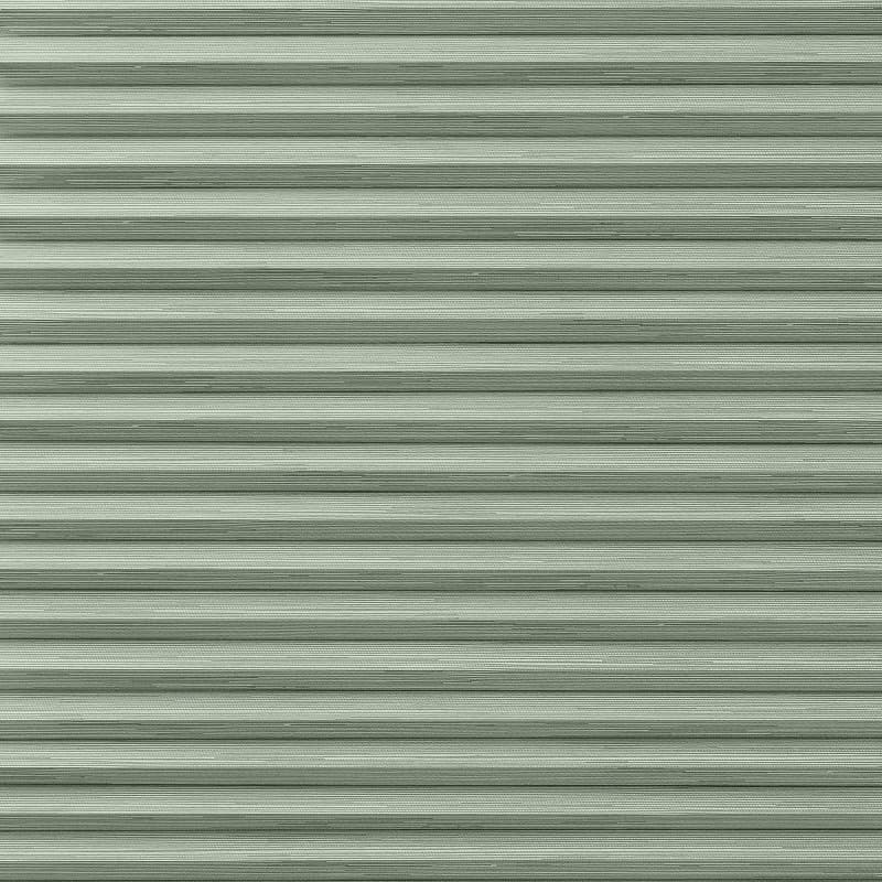 Horizontal metal roller shutter with narrow ribbed slats, fully closed across the opening; evenly lit muted green-gray surface, resembling a garage or storefront exterior with no visible interior or view.