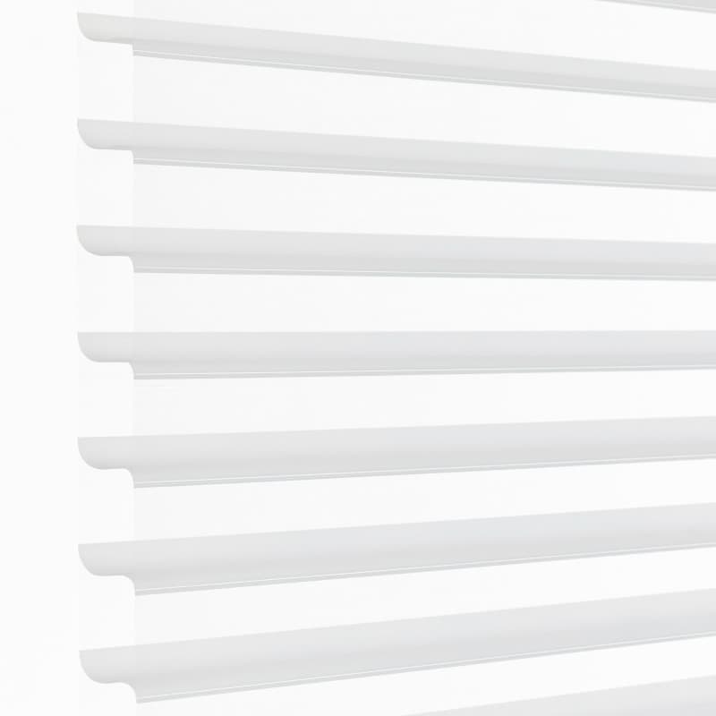 White horizontal sheer zebra blinds mounted over a window, alternating opaque and translucent bands; partially closed, filtering bright daylight into a minimal, evenly lit interior.