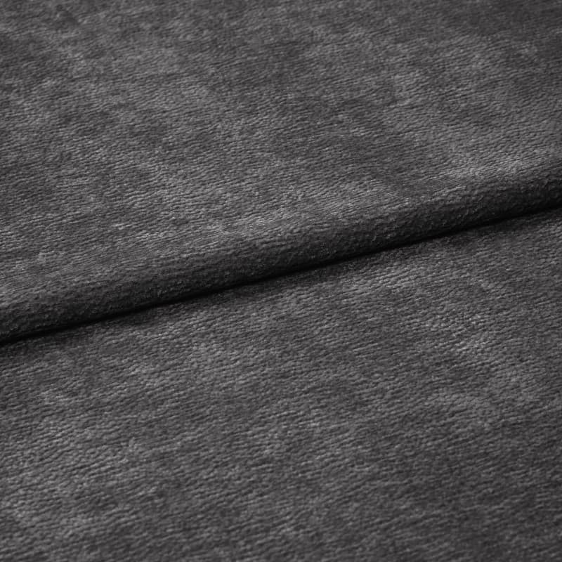 Charcoal-gray, soft-textured fabric (velvet-like) folded in a horizontal overlap, exposing fine nap and subtle sheen; close-up, evenly diffused lighting, neutral background suggesting a fabric sample.