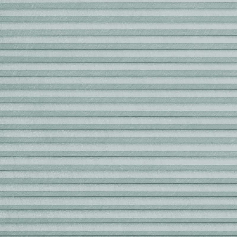 Horizontal pleated cellular blinds with pale teal and light-blue bands, fully closed and softly filtering light, filling the frame as a close-up of a window covering in diffuse daylight.