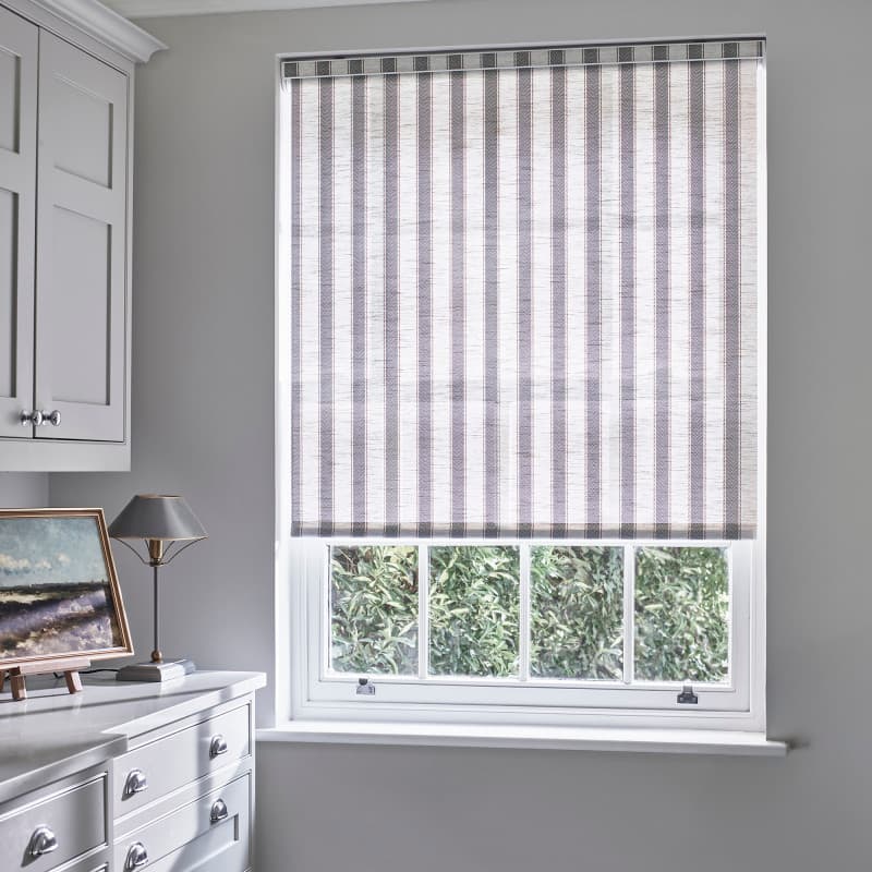 Tide Denim Roller Blind from Calm Living collection with grey and white stripes in a modern kitchen window.