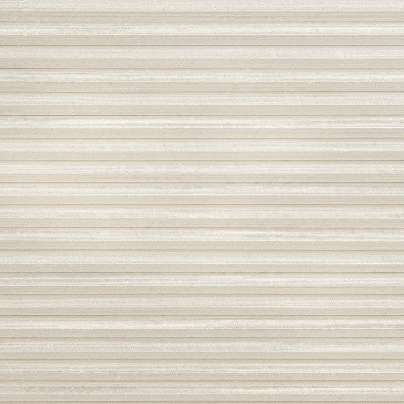 Beige pleated cellular blind, fully lowered, showing fine woven texture and narrow horizontal honeycomb folds; closed and diffusing soft daylight, likely covering a window in a neutral, softly lit room.