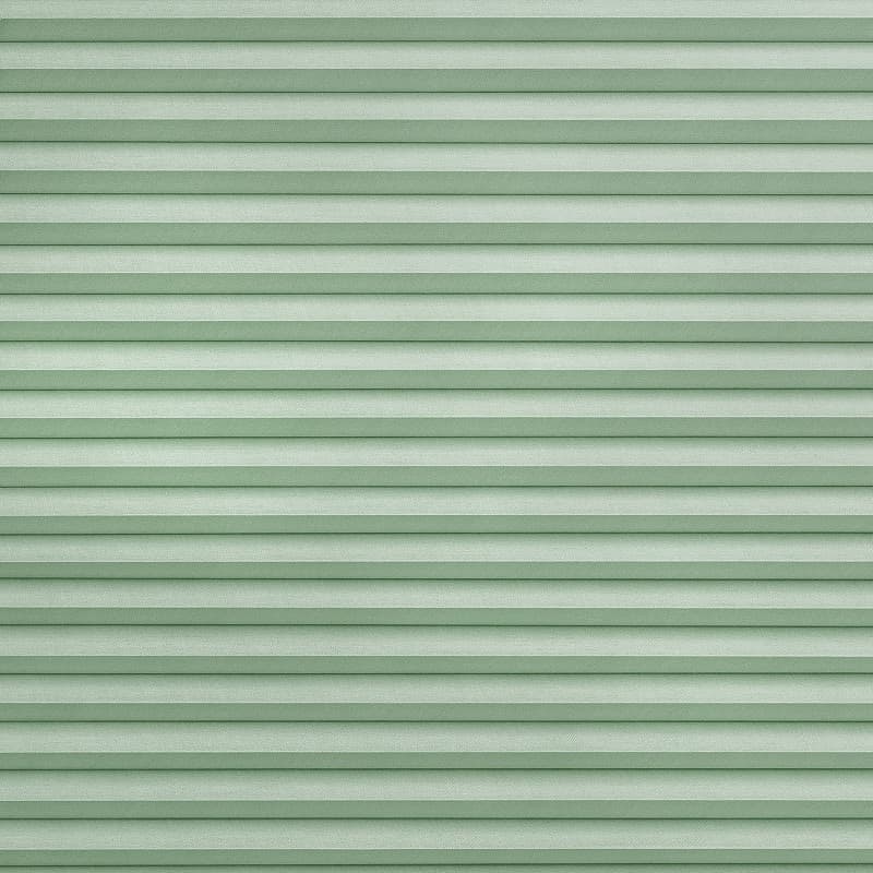 Horizontal pleated fabric blinds, mint-green, fully closed with narrow horizontal folds; blocking view while softly diffusing light, filling a flat, evenly lit surface with subtle textured stripes.