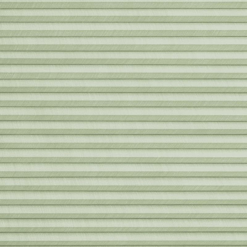 Pale green pleated cellular shade, fully closed and evenly aligned, filtering light subtly; fills the frame with textured horizontal ribs suggesting a softly lit interior window covering.