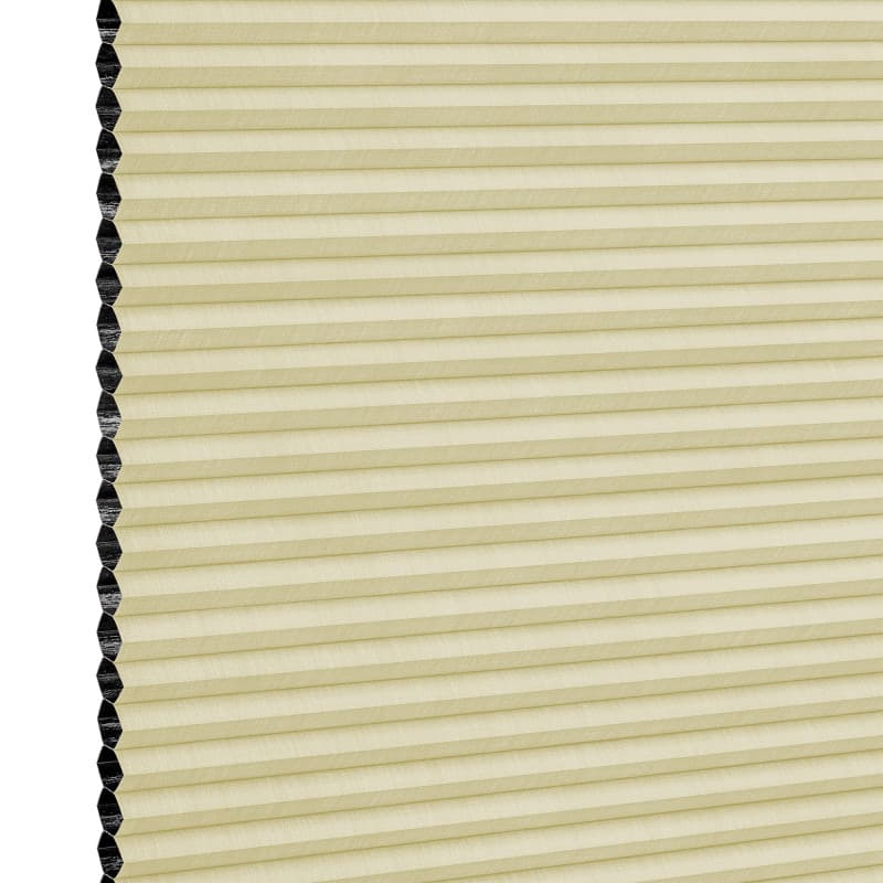 Cellular (honeycomb) window shade, lowered and closedâ€”beige pleated fabric with visible black hexagonal cell edges at leftâ€”softly filtering light, shown against a plain white background.
