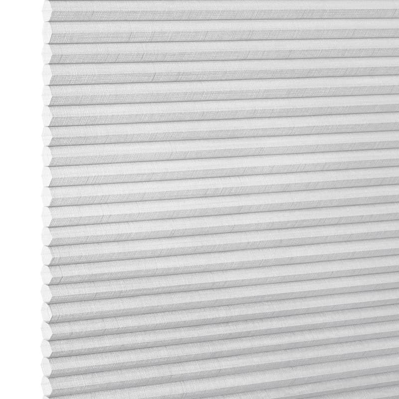 White honeycomb cellular shade, fully lowered with horizontal pleats and subtle linen texture; closed, diffusing soft light; fills a bright interior window opening, neutral minimalist room lighting.