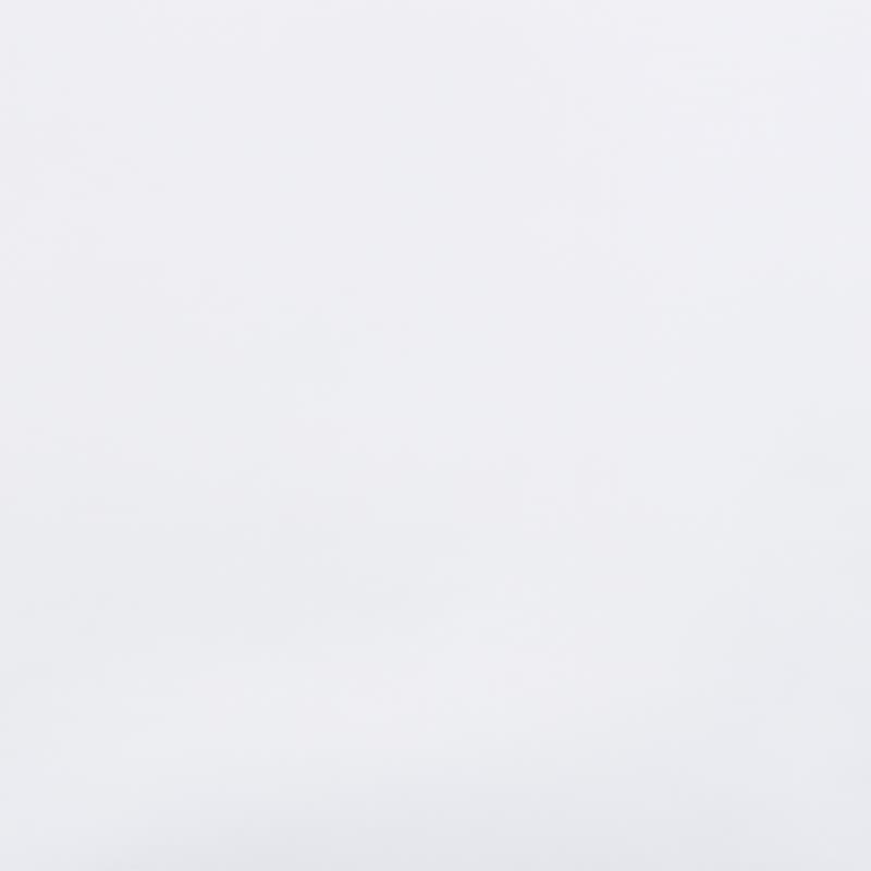 Unadorned white wall filling the frame, uniformly illuminated and featureless, creating a bright, minimal interior backdrop with soft, diffused lighting and no visible furniture or windows.