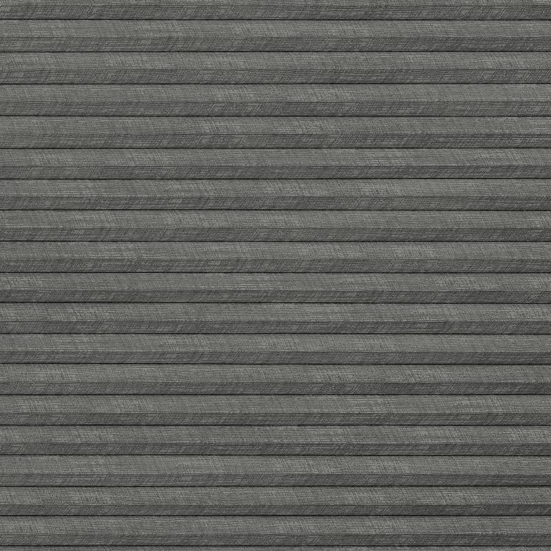Gray textured horizontal pleated fabric blinds, fully closed with overlapping slats and subtle weave, blocking any view; set against an interior wall under soft, even indoor lighting.
