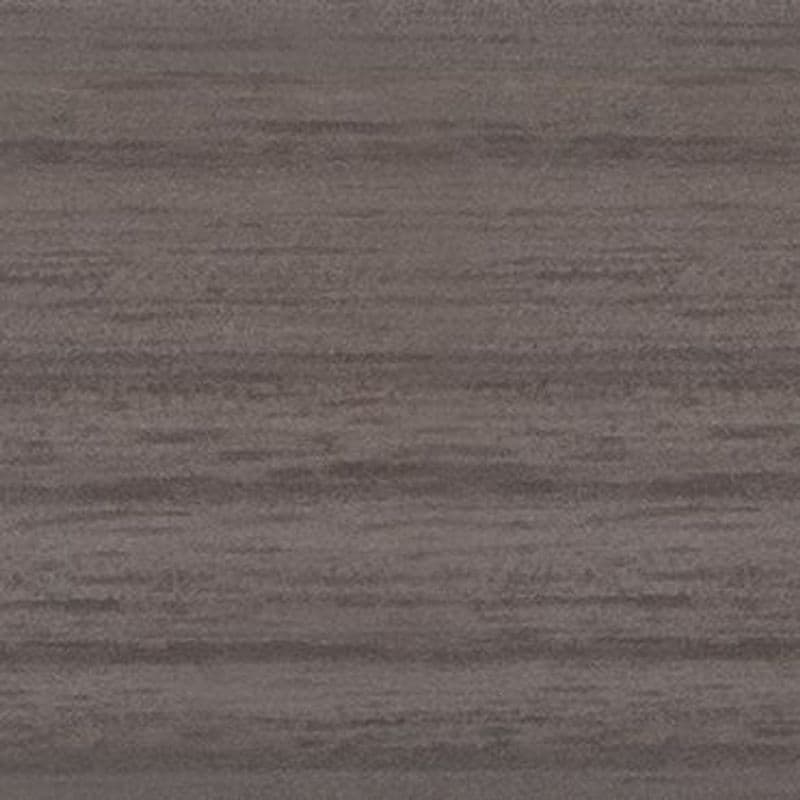 Gray-brown textured surface (appears like fabric or wood grain) displaying subtle horizontal striations; close-up, evenly lit, filling the frame with muted, neutral tones.