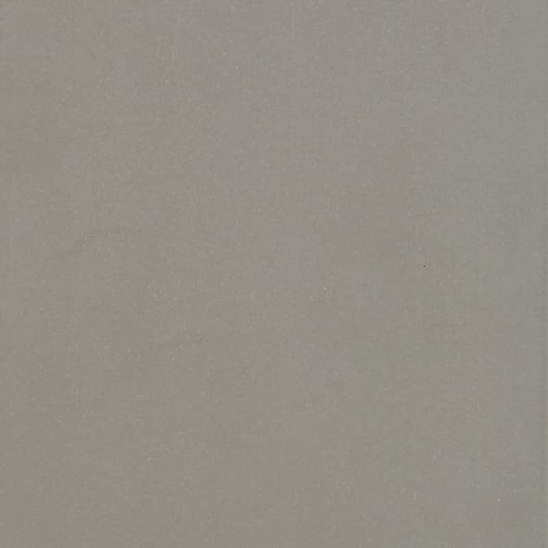 Light-gray textured sheet or wall sits flat and unadorned, filling the frame under even diffuse lighting, with subtle speckling and a faint vertical edge visible.