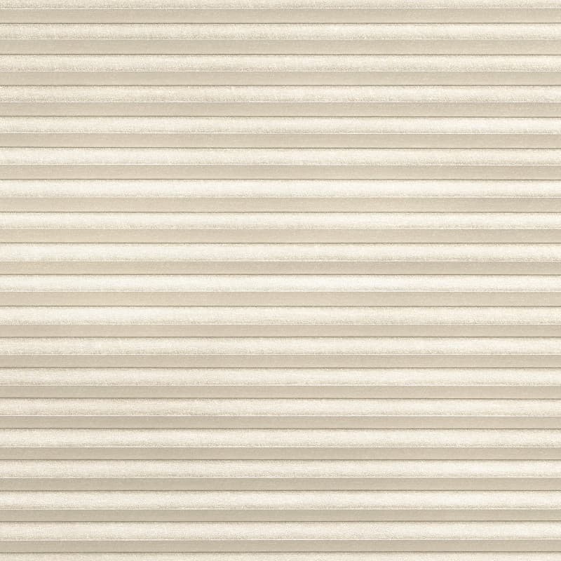 Cream-colored, textured horizontal pleated cellular shades filling the frame, fully lowered and closed, softly diffusing light; neutral interior setting with even ambient lighting and no visible window or view.