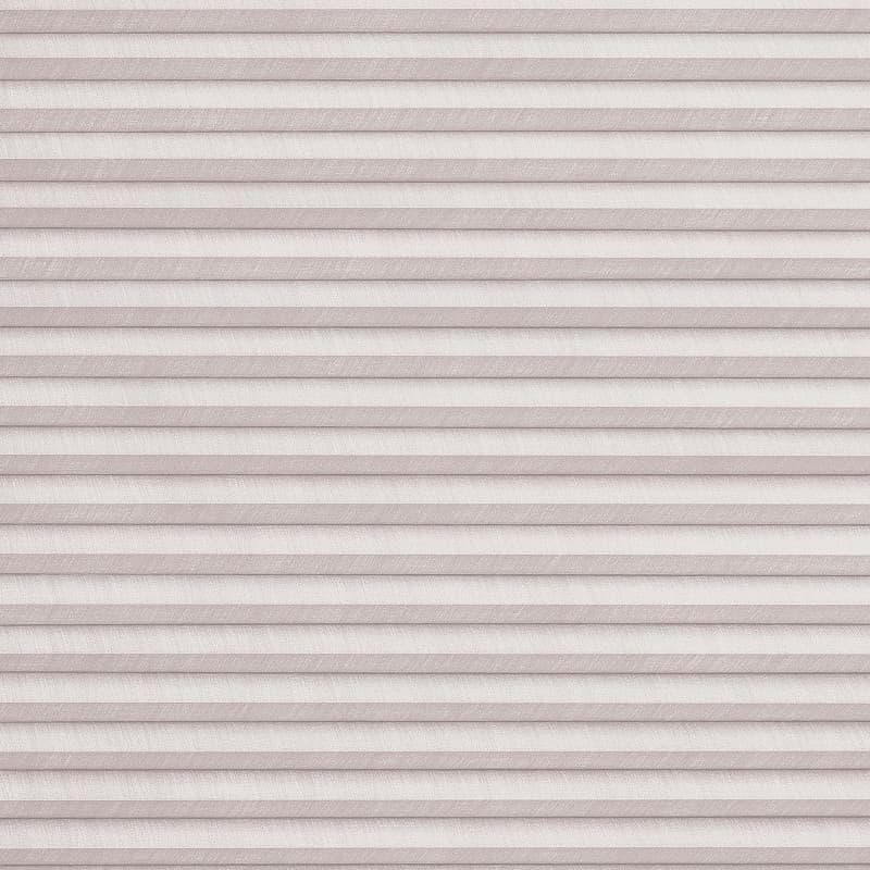 Horizontal pleated cellular blinds, full-width and fully lowered, pale blush textured fabric; closed and filtering soft diffuse light, concealing the window and creating a uniformly lit, neutral interior surface.