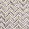 Chevron-patterned fabric of painted brushstrokes in lavender, olive, and black; staggered V rows repeat across a flat, evenly lit surface, resembling a wallpaper or upholstery sample.