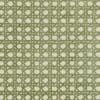 Green geometric woven fabric with interlocking diagonal bars and pale rounded squares, repeating lattice pattern, lying flat as textured upholstery or wallpaper close-up under soft, even light.