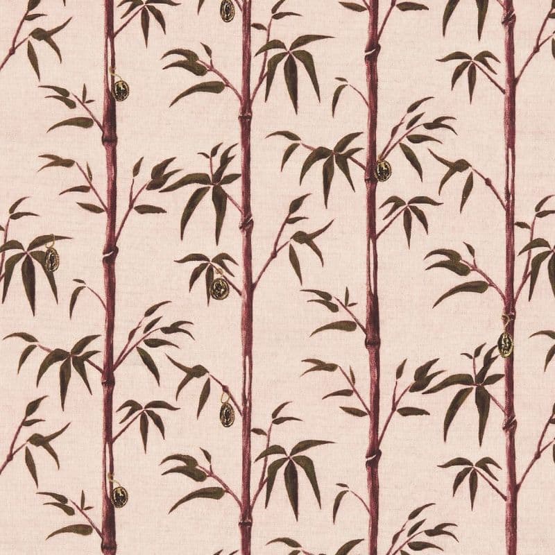 Vertical maroon bamboo stalks with dark green leaves and small hanging oval pods — arranged in repeating printed columns — on a pale pink textured wallpaper or fabric background.