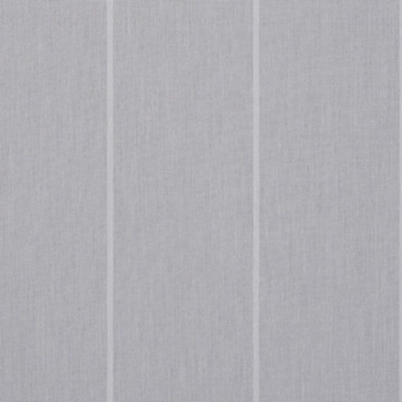 Light-gray fabric curtain panels with subtle vertical seams, closed and diffusing light; hung across a window in a softly lit interior, no outside view visible.