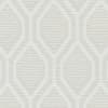 Upholstery fabric shows interlocking rounded-hexagon trellis pattern in soft white over beige, horizontal ribbed texture, close-up view.