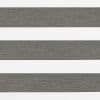 Horizontal dual-layer zebra roller blind, textured gray and white alternating bands across the frame; aligned to create opaque stripes, close-up of a neutral interior window covering under soft light.