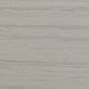 Light gray wood-grain panel with subtle horizontal streaks; lying flat and static, showing fine texture; close-up view of an evenly lit interior surface resembling laminate wall or tabletop.