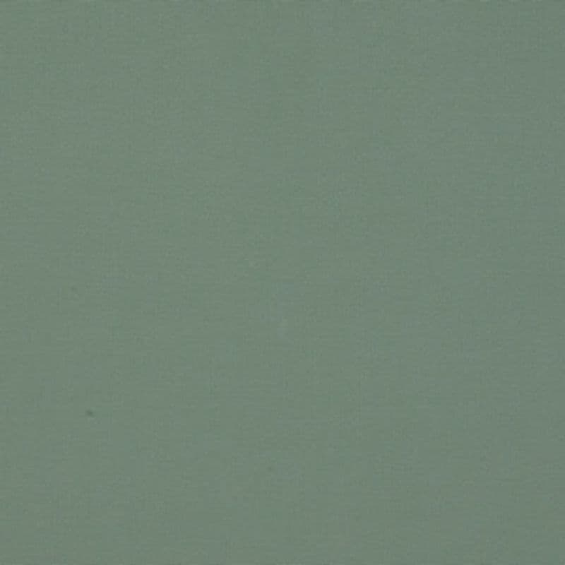 Matte muted green wall with fine, even texture occupying the entire frame, appearing uniformly lit and smooth, suggesting a softly lit interior surface or fabric backdrop.