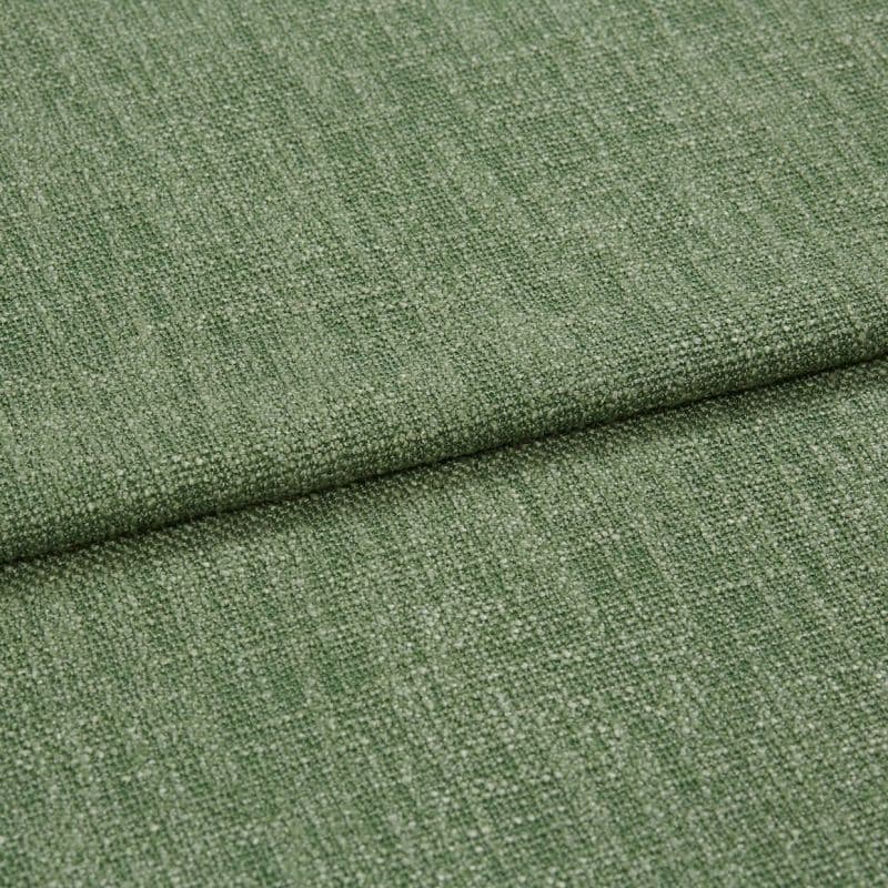 Green woven upholstery fabric, folded with an overlapping edge across the center; textured loop-and-yarn weave; close-up studio shot with soft, even lighting on a neutral background.