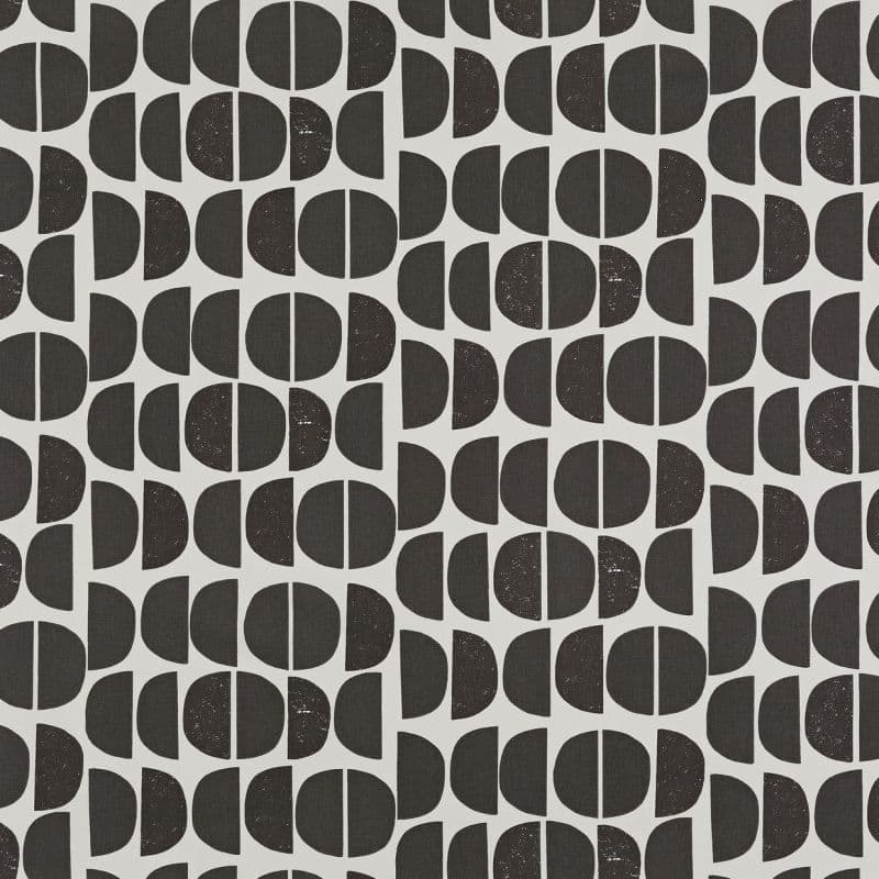 Wallpaper featuring repeating black semicircles and vertically bisected circles, arranged in alternating columns; shapes appear slightly distressed, creating a mid-century geometric pattern across a pale gray background.