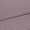 Folded fabric featuring tight purple-and-white chevron stripes, folded to form a shallow diagonal ridge; close-up view of a flat textile sample with even, neutral lighting.