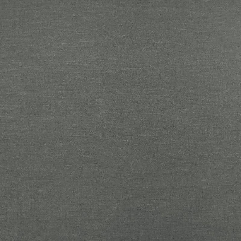 Dark gray woven fabric roller blind, fully lowered and smooth; filtering light and blocking view; fills the frame with uniform texture under neutral indoor lighting, no other room features visible.