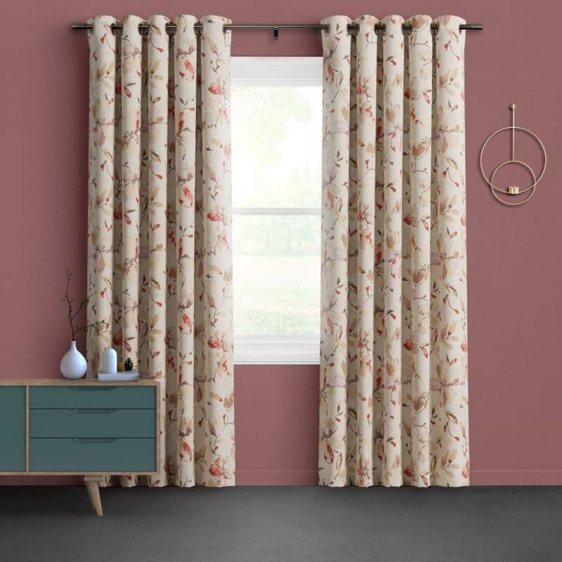 Floral grommet curtains (cream with pink‑beige leaves) hang on a rod, parted to frame a window; set against mauve walls with a teal dresser and circular sconce, lawn visible outside.