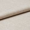Beige woven fabric with a tight, looped texture, folded over itself; close-up studio view with soft, even lighting highlighting subtle sheen and detailed weave.