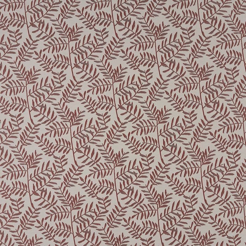 Beige wallpaper or fabric patterned with repeating maroon fern-like branches; the motif prints across the surface in a seamless repeat, shown as a flat, evenly lit close-up.