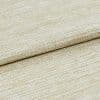 Beige woven fabric with looped, ribbed texture, folded across the frame; lying in a close-up studio view under soft, even lighting, emphasizing the textile's weave and subtle sheen.