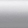 Silver metallic textured surface occupying the frame, scattering diffuse light with a subtle horizontal gradient; a flat, finely granulated panel in a neutral, evenly lit background.