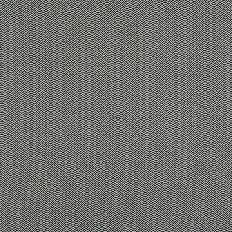 Chevron-patterned fabric curtains, two vertically seamed panels with small black-and-white zigzag weave, drawn closed, filling the frame and blocking view in diffuse indoor lighting.