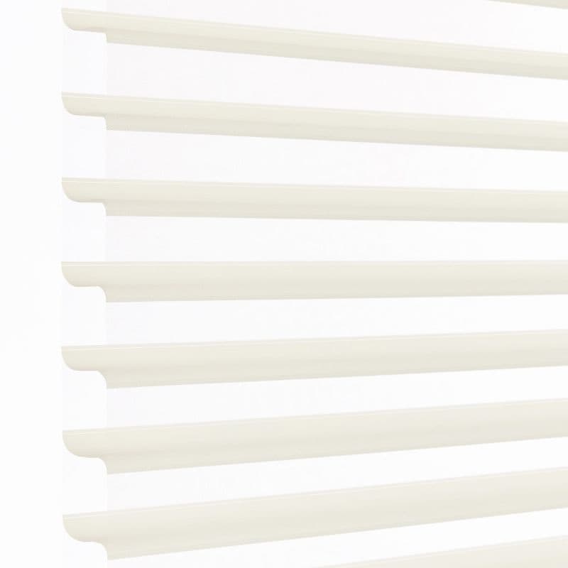 White layered zebra blinds with horizontal opaque slats and sheer panels, mounted left, covering window; slats angled to filter bright daylight into a minimally visible, softly lit interior.
