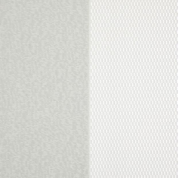 Two vertical fabric panels (curtains): left opaque light gray textured, right sheer white with small rectangular pattern; both closed, gently filtering diffuse daylight in a neutral-lit interior.