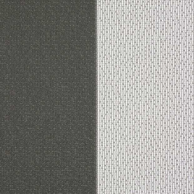 Two window dressings: a dark, opaque fabric panel left and a white sheer mesh right — closed, the sheer filtering bright daylight from the window behind.