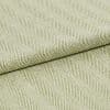 Pale green woven fabric with raised diagonal ribbed herringbone pattern, folded across the frame; the fabric displays pronounced texture and ridges under soft, even studio lighting in a close-up view.