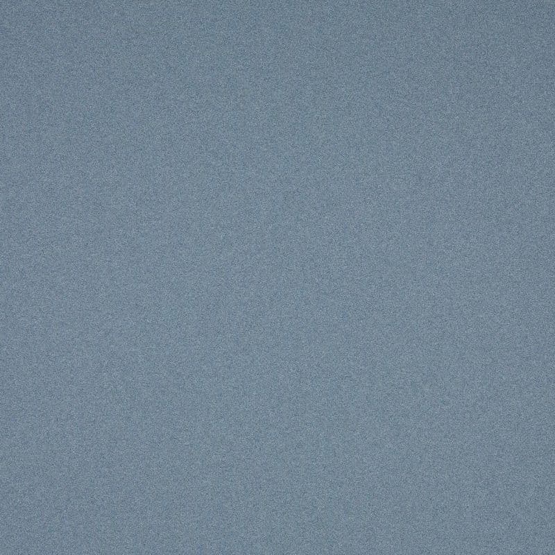 Blue-gray speckled fabric surface filling the frame; lying flat and uniform; fine-grain texture under soft, even lighting with no other visible objects.