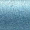 Fine blue glitter surface with densely packed sparkling particles, shimmering and reflecting light in a lighter-to-darker vertical gradient; close-up macro view under diffuse lighting.