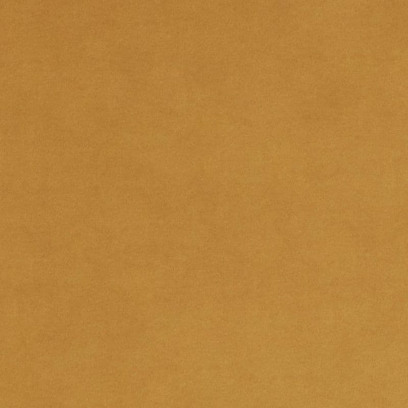 Tan, slightly mottled paper filling the frame; flat and unwrinkled, evenly lit, resembling kraft cardboard with subtle fiber texture, occupying a plain neutral background.