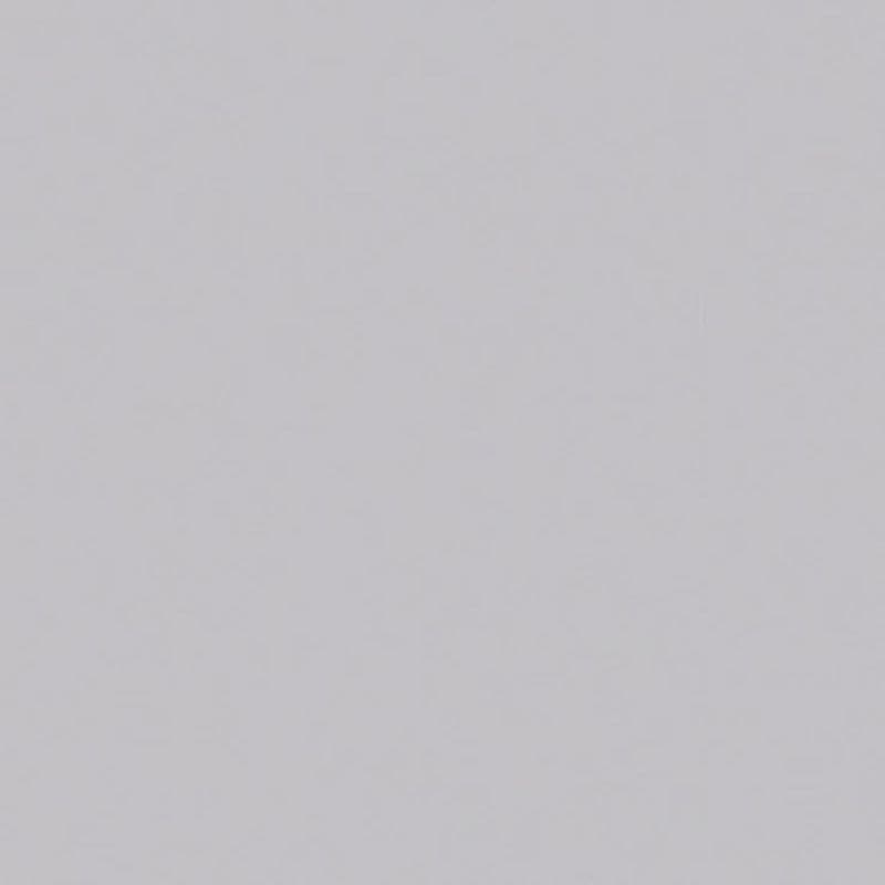 Light-gray smooth wall surface filling the entire frame; uniformly lit and featureless, showing no window dressings, fixtures, furniture, or other contextual details.