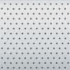 Light gray perforated panel mounted flat, featuring uniform, evenly spaced circular holes; fills the frame, evenly lit, minimal neutral background.
