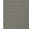 Grey cellular (honeycomb) pleated blind, fully lowered with visible hexagonal side cells, blocking light; close-up view showing textured fabric and narrow horizontal pleats, plain neutral background.