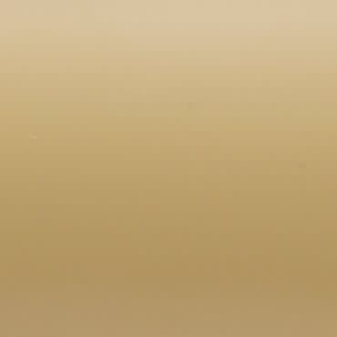 Smooth beige wall with faint vertical gradient, showing subtle texture; absorbing soft, even light in a neutral, featureless background.