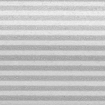 Horizontal pleated blinds, closed, showing alternating light and dark textured bands; filtering soft diffuse light; close-up view filling the frame, neutral grayscale tones suggesting indoor lighting.